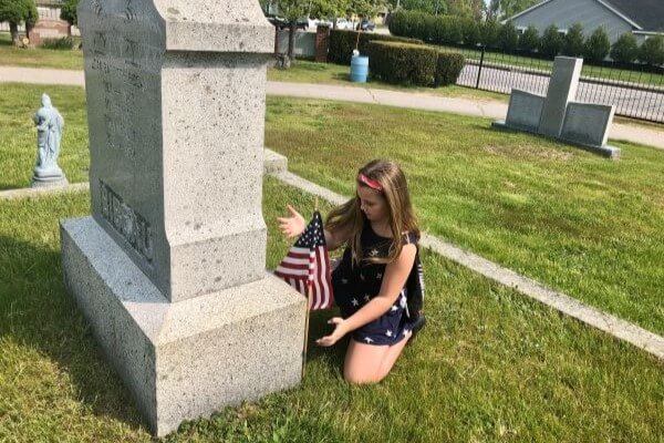 Biddeford students put flags on veterans' graves