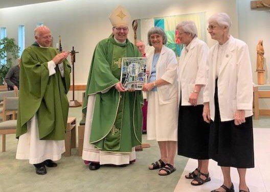 Bishop Deeley Presents Matthew 25 Award and Grant to Esther Residence in Saco
